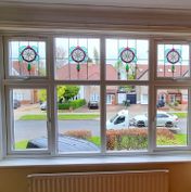 Interior: uPVC windows with decorative leads and stains to fanlights