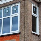 uPVC windows with decorative leads and stains to fanlights