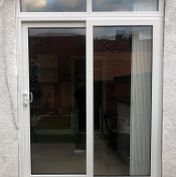 uPVC 2-panel sliding patio door with toplights.