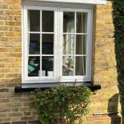 Interfusion flush fit timber windows with ovolo Georgian bars